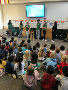 High School students speak in kindergarten assembly