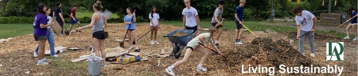 Large group of students spreading mulch
