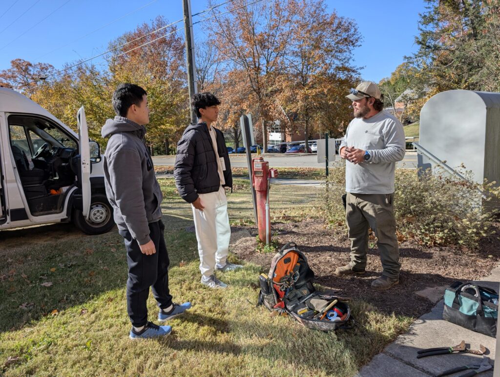 Upper School students talk to electrician